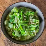 Green goddess gnocchi with asparagus peas and courgettes