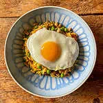 Top view of vegetarian Nasi goreng with fried egg