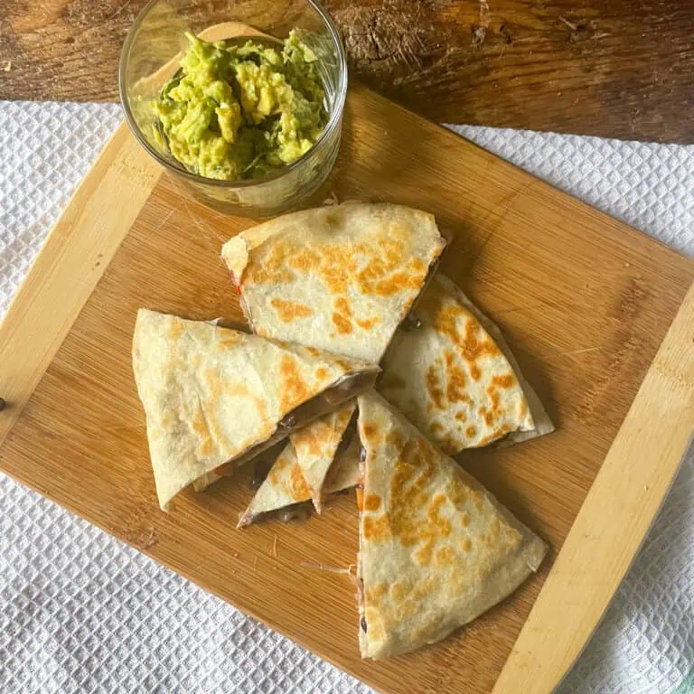 tasty black bean quesadillas top view with avocado and mint dip