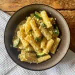 top view of mushroom courgette and ricotta pasta in a brown bowl