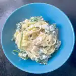 Bowl of creamy ricotta pasta with wilted spinach – easy and satisfying homemade dinner recipe.