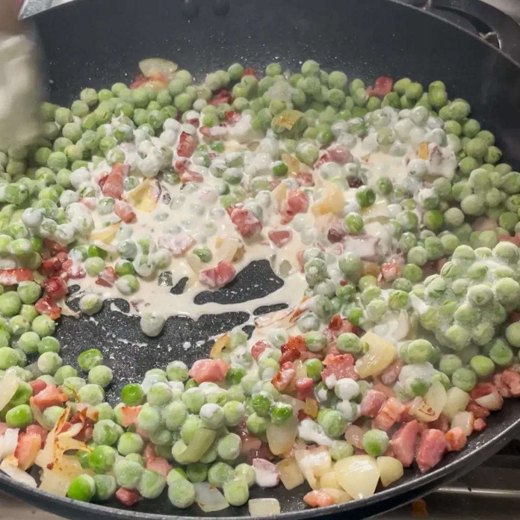 Process shot 1 - making the peas with pancetta and cream