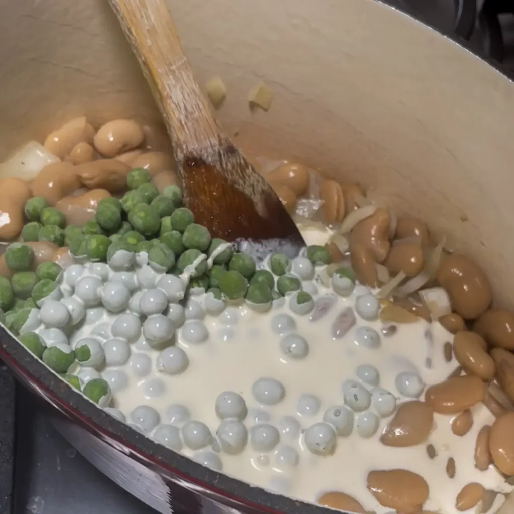 Creamy beans process shot 3 - adding the peas and cream