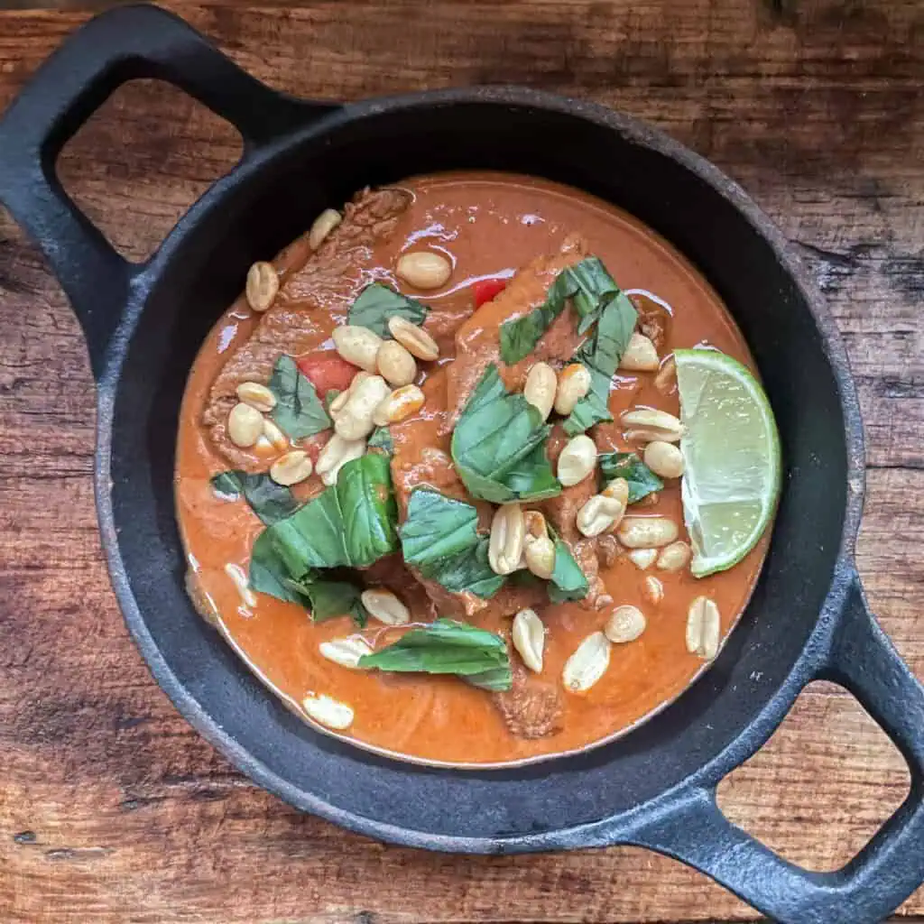 Beef Penang curry served in a traditional bowl