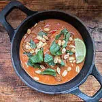 Beef Penang curry served in a traditional bowl
