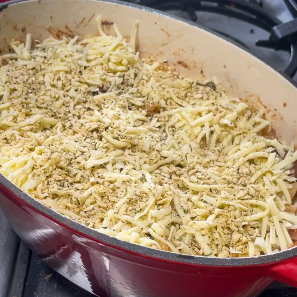 Bolognese pasta bake process shot 4 - adding mozzarella and breadcrumbs