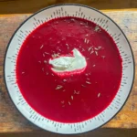 roasted beetroot soup in a white bowl