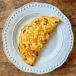 cheese and chorizo omelette on a white plate