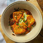 A one pan chorizo breakfast bake in a casserole dish with potatoes and egg