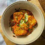 A one pan chorizo breakfast bake in a casserole dish with potatoes and egg