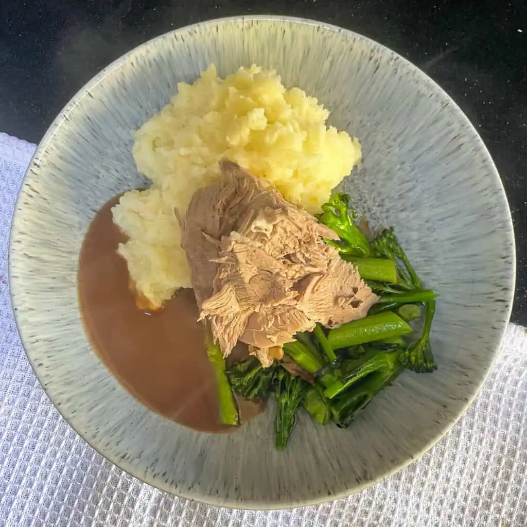 Plated up roast duck with truffle mash and broccoli