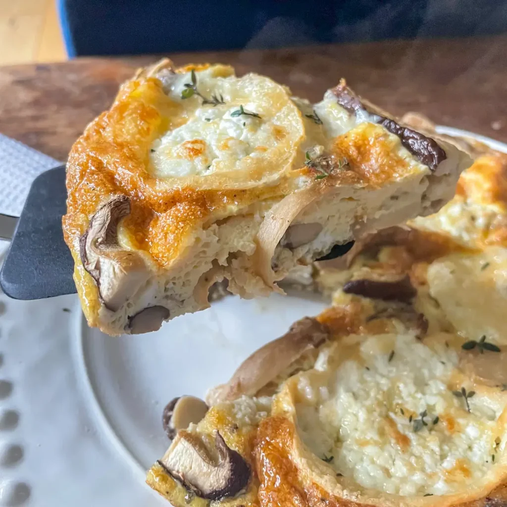 A slice of mushroom and goats cheese frittata