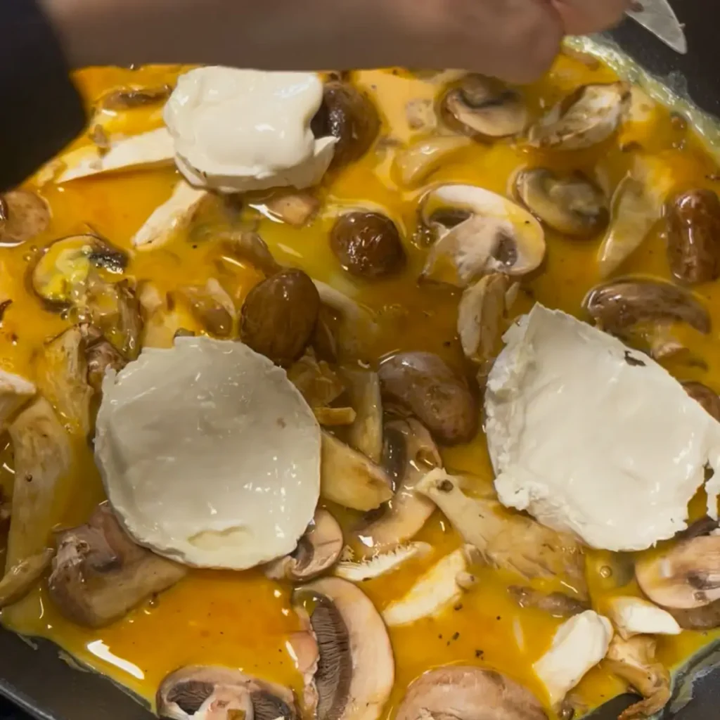 Frittata process shot 4 - top with goats cheese and put under the grill