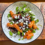 Top view of a homemade salad made from carrot, beetroot, watercress, lentils and honey dressing
