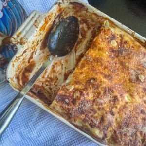 Classic beef lasagne In a dish, partially served
