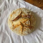 Homemade white sourdough Loaf with flour