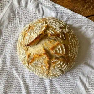 Homemade white sourdough Loaf with flour