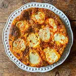 Frittata with chorizo and mozzarella on a white plate