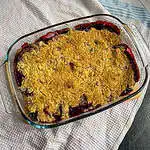 Apple and blackberry crumble On a white tea towel