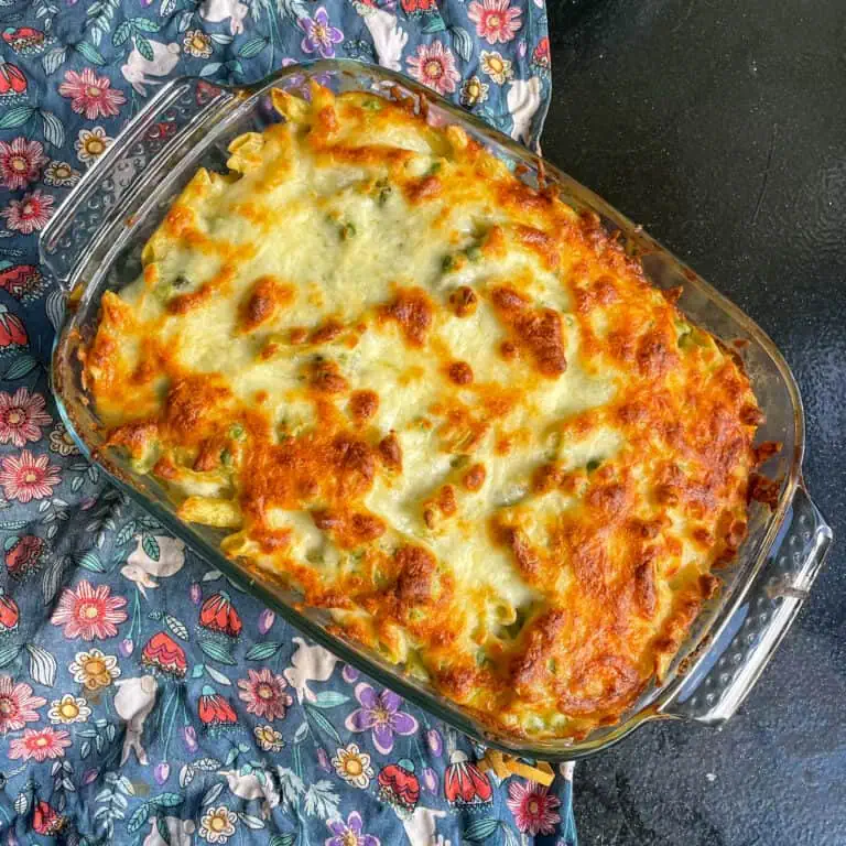 Creamy pesto pasta bake Top view with golden cheesy topping