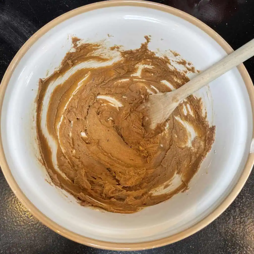 Step two for making apple loaf cake: add butter and beat until thoroughly combined