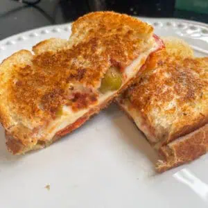 Chorizo and mozzarella hot sandwich Close up with green olives