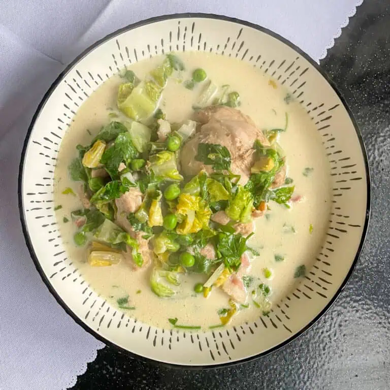 One pot chicken bacon and peas Main image in a black and white bowl