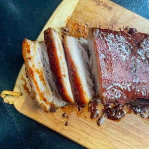 Braised pork belly Sliced on a wooden board