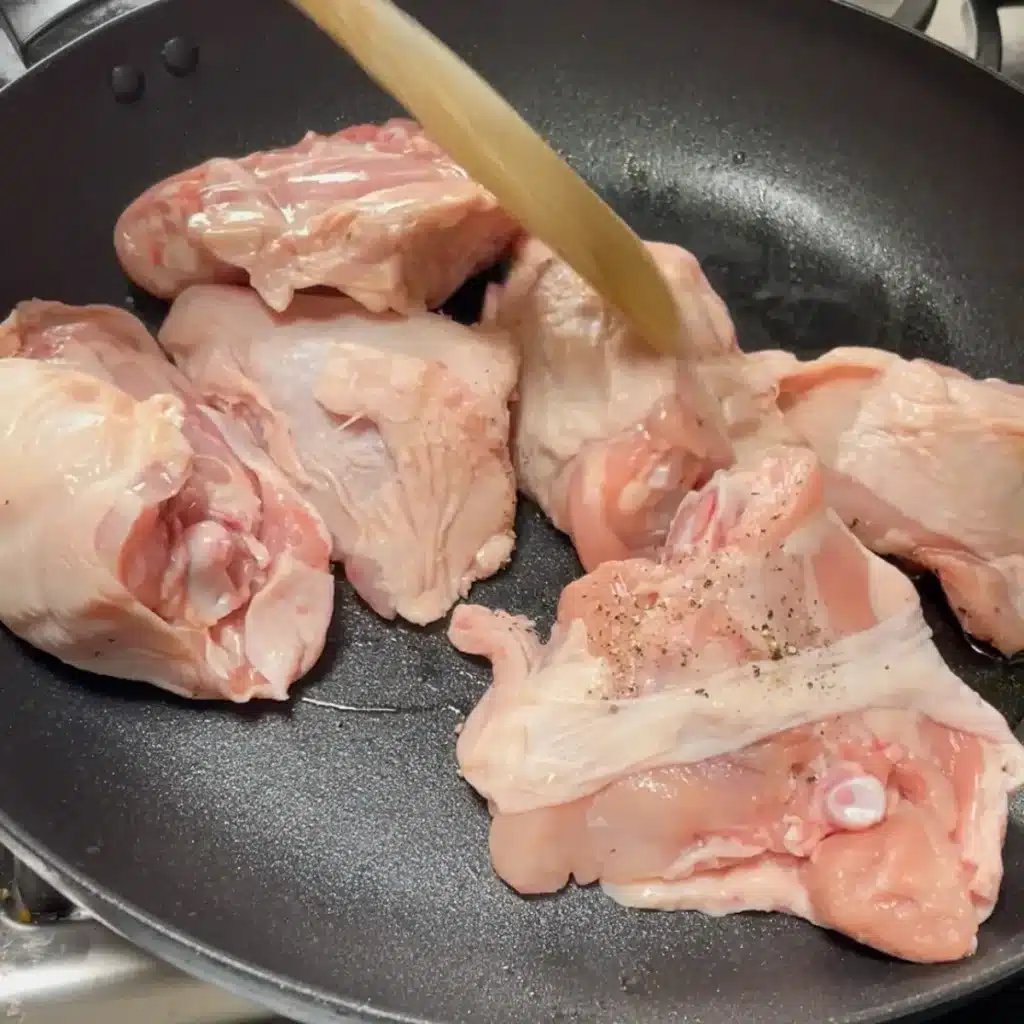 Cooking coq au vin pie - browning the chicken thighs