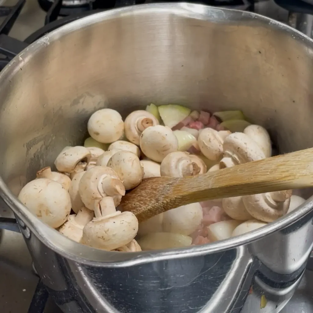 Cooking coq au vin pie - Cooking the pancetta, onion, garlic and mushrooms