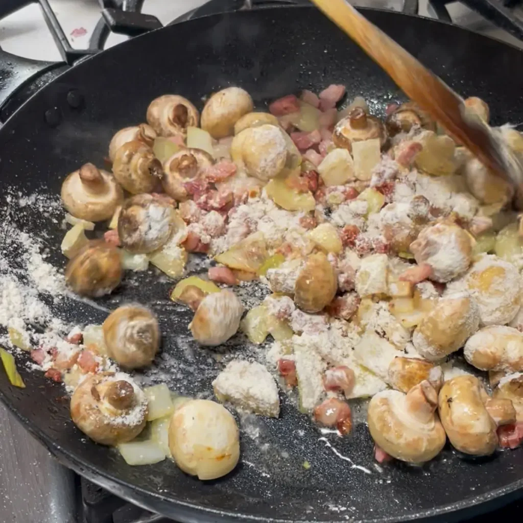 Cooking coq au vin pie - Adding the flour