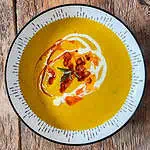 Roasted squash soup In a white bowl