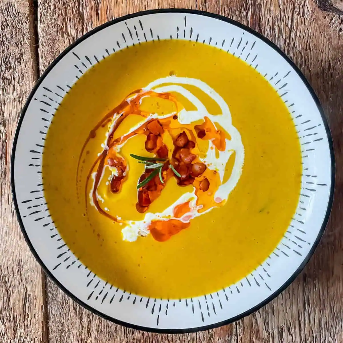 Roasted squash soup In a white bowl