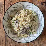 Vegetarian garlic mushroom orzo In a white bowl