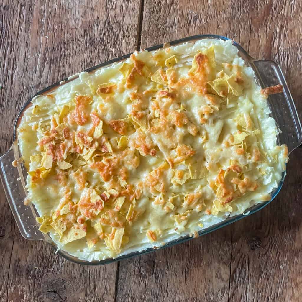 Beef chilli pie topped with cheesy nachos