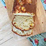 Coconut and mango loaf cake cut into slices