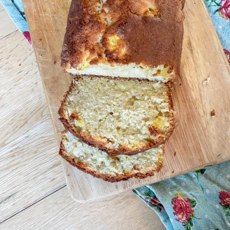 Coconut and mango loaf cake cut into slices