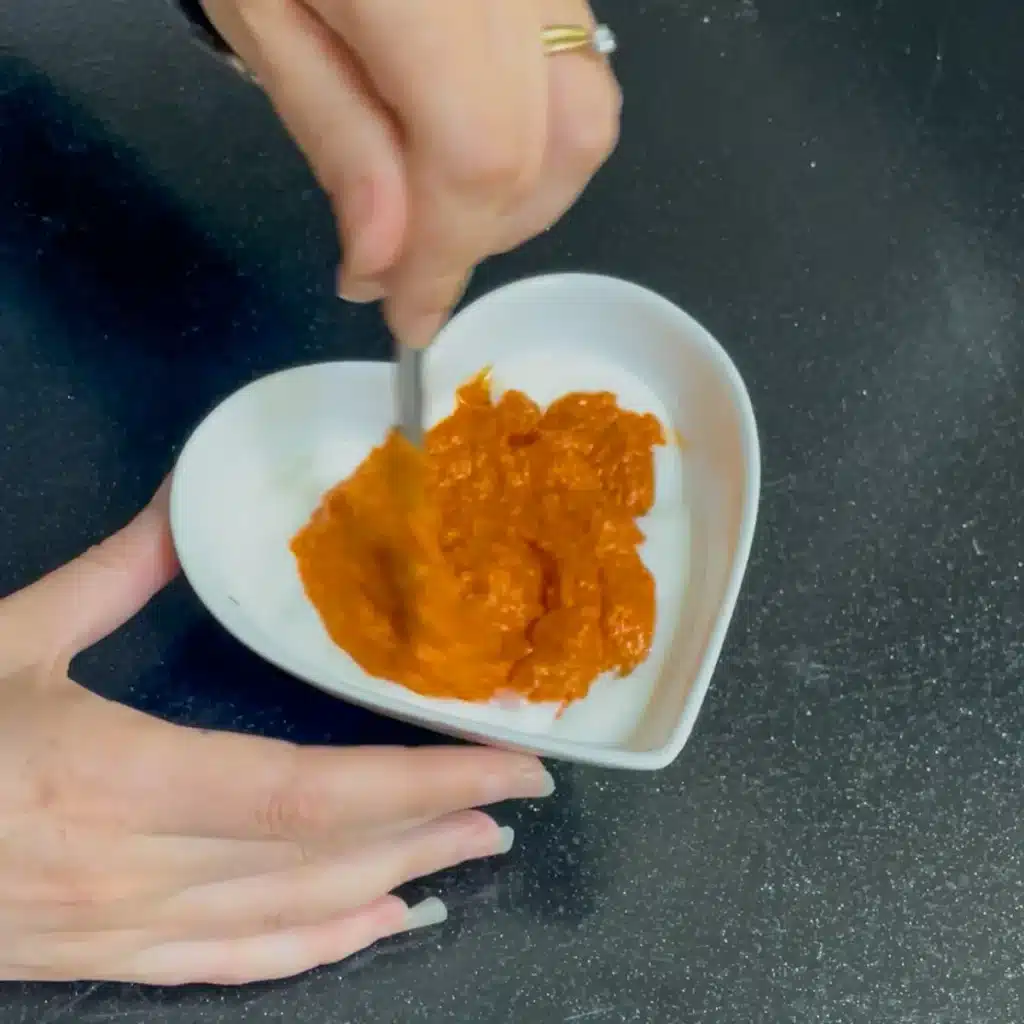 Process shot 2 - mixing red pesto and yoghurt to make dressing