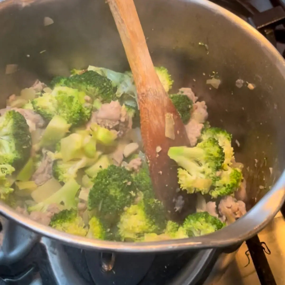 adding the broccoli and cooking down
