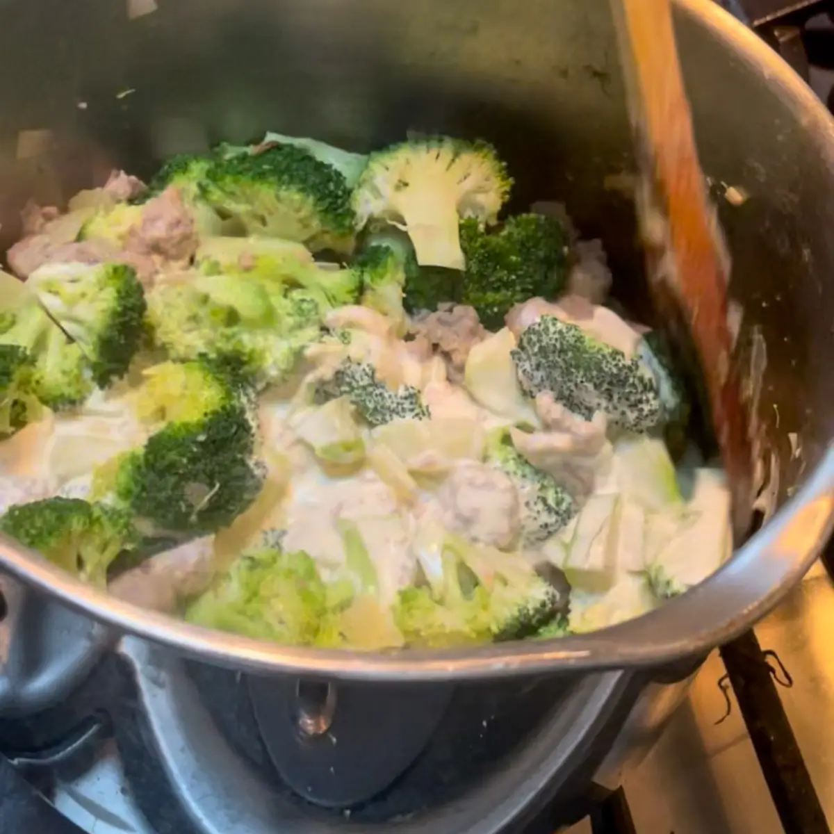 adding cream and parmesan