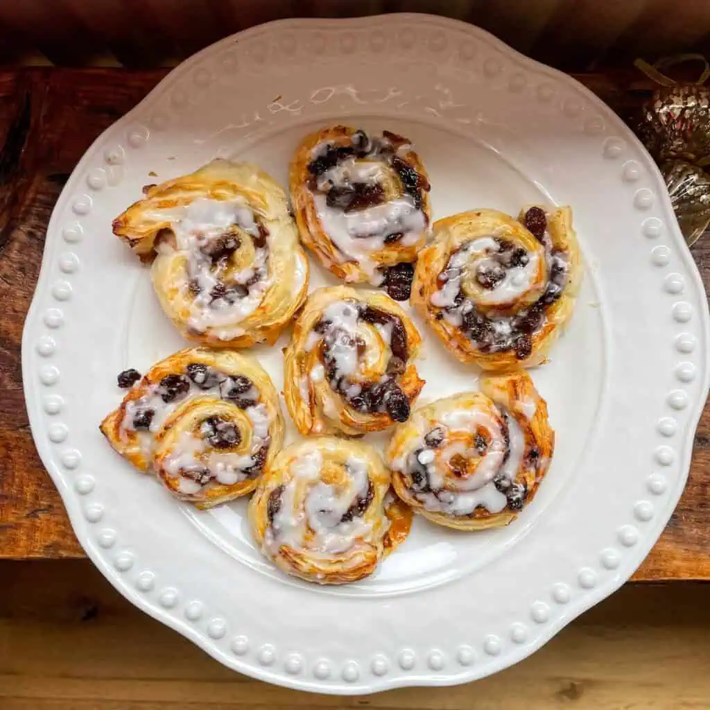 A white plate with a selection of mince pie puff pastry spirals