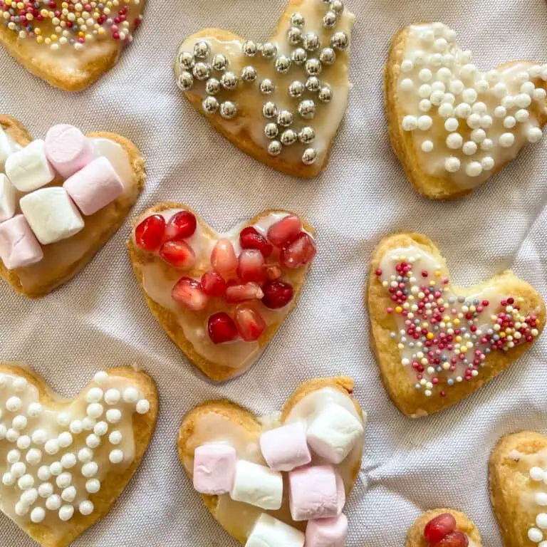 Homemade heart cookies for Valentine’s Day with a selection of toppings