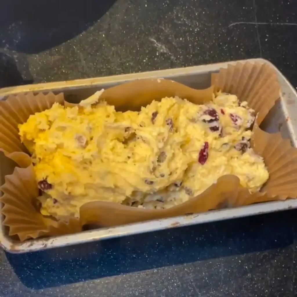 Process shot 5 - spooning into a loaf tin 