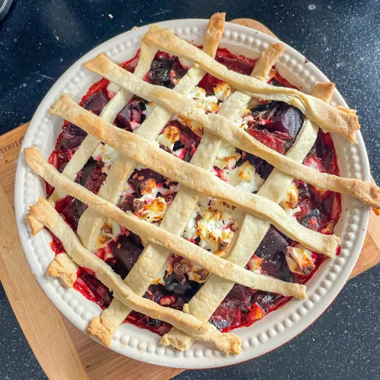 Top view of beetroot and feta pie with lattice pastry