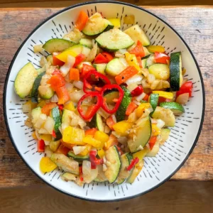 salt and pepper flavoured courgettes in a white bowl