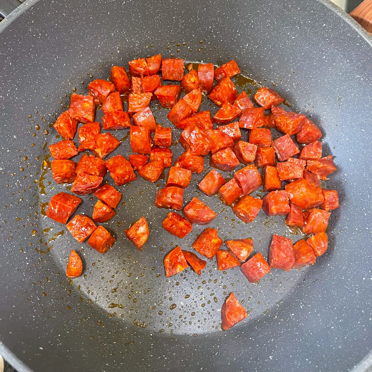 diced chorizo cooking in a pan