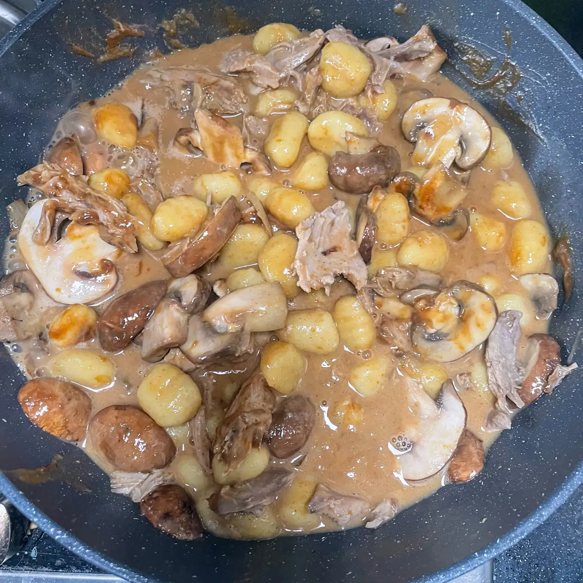 adding duck and hoisin sauce to the pan