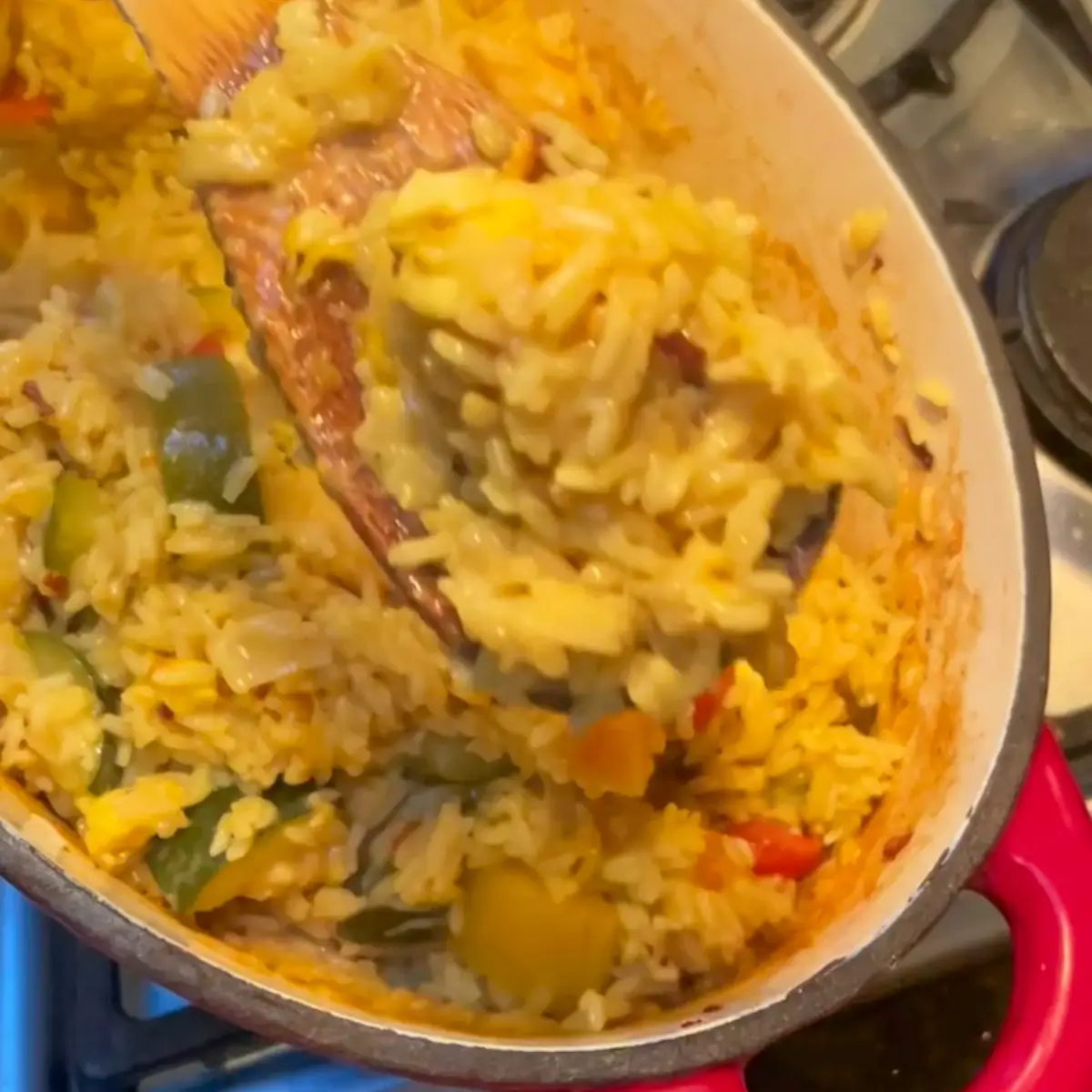 stirring halloumi rice before serving
