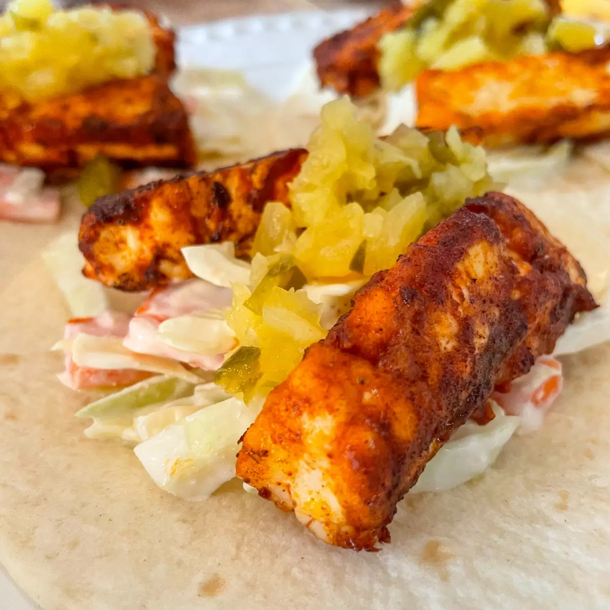 close up of golden fried halloumi in a taco