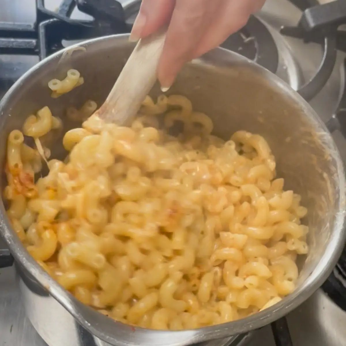 stirring one pot Mac and cheese